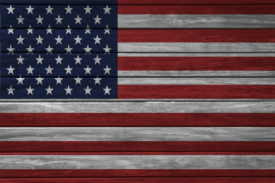 American national flag painted on wood background.