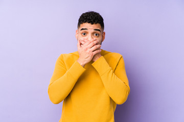 Young mixed race arabic man isolated shocked covering mouth with hands.