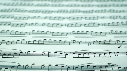  A sheet of paper with musical notes. Abstract background from musical notes for the designer.