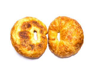 Studio shot two fresh baked French butter croissant isolated on white
