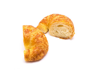 Two half cut of fresh baked French butter croissant isolated on white background
