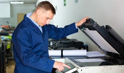 Service engineer using a copy machine