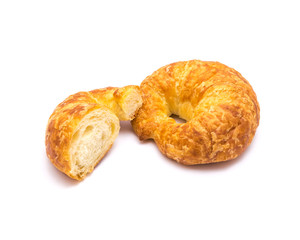 Studio shot one fresh baked French butter croissant with cutout piece isolated on white