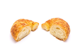 Two half cut of fresh baked French butter croissant isolated on white background