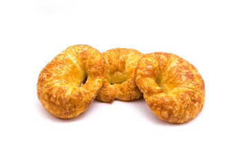 Studio shot three fresh baked French butter croissant isolated on white