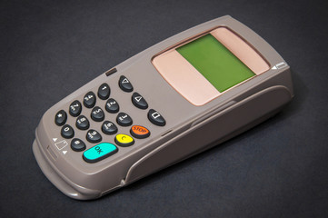 Payment terminal for receiving money on isolated black background