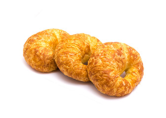 Studio shot three fresh baked French butter croissant isolated on white