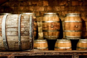 Retro old barrel on wooden table and free space for your decoration. 