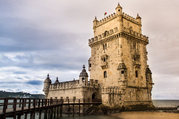 Fototapeta na wymiar Lisbon, Belem Tower - Tagus River, Portugal one of the most famous attractions of Portugal, iconic monument built as a defense tower.