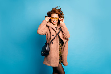 Portrait of cute pretty content woman touch yellow sunglass enjoy season holiday wear look good...