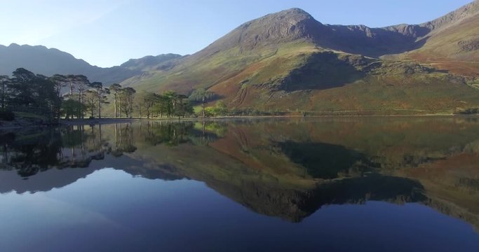 The Lake Buttermere pines and peaks of High Crags, Lake District National Park, Cumbria, England, United Kingdom, Europe