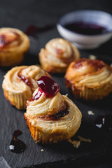 Small puff pastry rolls with cherry jam