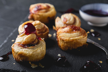 Small puff pastry rolls with cherry jam