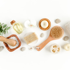 Spa concept with eucalyptus oil and eucalyptus leaf extract natural /organic spa cosmetics products, eco friendly bathroom accessories. Skincare concept on white background. Flat lay composition 