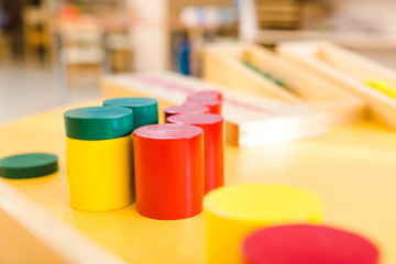 Selective focus of colorful educational game on desk in school