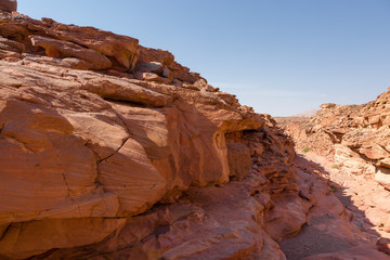 Fototapeta na wymiar Coloured Canyon is a rock formation on South Sinai (Egypt) peninsula. Desert rocks of multicolored sandstone background.