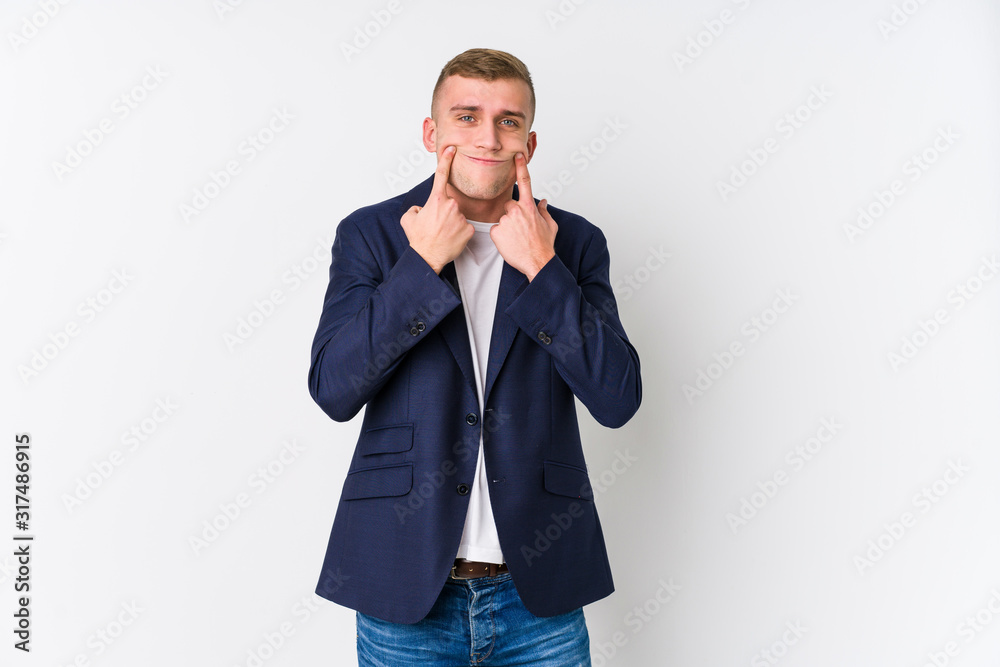 Wall mural young business caucasian man doubting between two options.