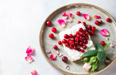 Heart shaped cappuccino and cheese sandwich with red berries.The idea for a festive breakfast, Valentine's Day.