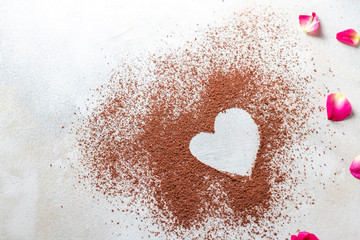 Heart made of cocoa powder on white background. The idea for a festive breakfast, Valentine's Day.