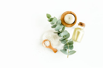 Obraz na płótnie Canvas Spa Background. Natural/Organic spa cosmetics products, eco friendly bathroom accessories, eucalyptus leaves. Skincare concept on white background. Flat lay, top view