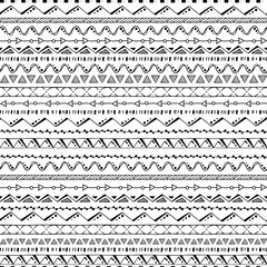 Hand drawn tribal seamless vector pattern background in classic black and white .
