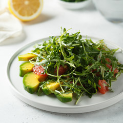 Arugula salad with grapefruit and avocado