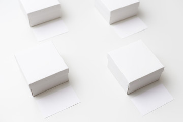 Mock up of four same size white boxes and business cards on the white background