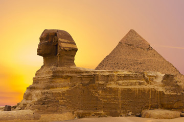 Sphinx against the backdrop of the great Egyptian pyramids. Africa, Giza Plateau.