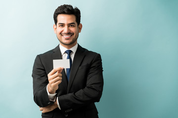Attractive Male Professional With Placard In Studio