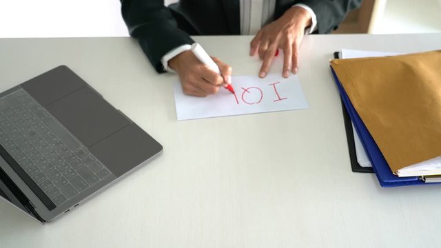 4k video of Business man signing his resignation in office write I Quit on letter before sending to his boss, concept of decision to resign job.
