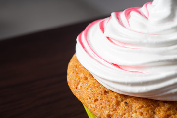 Vanilla cupcake, with a protein cream in the form, stained with red currant juice.