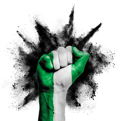 Nigeria raised fist with powder explosion, power, protest concept - obrazy, fototapety, plakaty