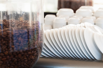 Fototapeta na wymiar White ceramic saucers and small espresso cups