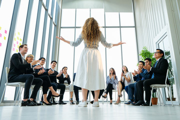 Rear view of Business colleagues discussing report at modern office. Business People applauding while in meeting at office, The Secret to successful business concept