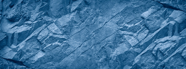 Blue grunge banner. Abstract stone background. The texture of the stone wall. Close-up. Classic...