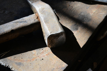 a hammer in rusty metal background