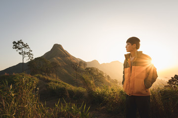 A male hiker standing on the mountain