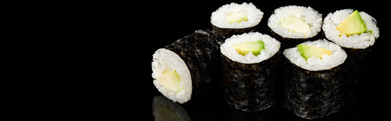 delicious sushi maki with avocado isolated on black, panoramic shot © LIGHTFIELD STUDIOS