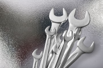 Metal wrench tools on texture background
