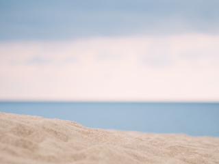 Fototapeta na wymiar Closeup of sand with sea background