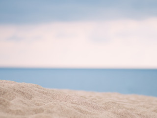 Fototapeta na wymiar Closeup of sand with sea background