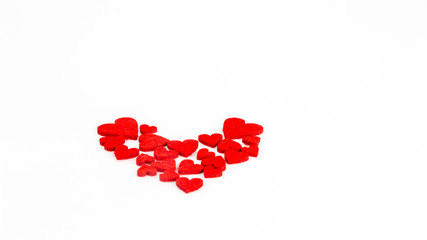 Red heart shapes on white background for Valentine's Day.
