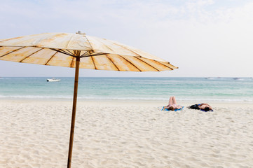 Umbrella on a perfect white sand beach