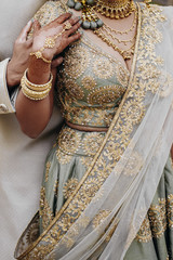 Front view of traditional indian wedding dress and bridal precious accessories