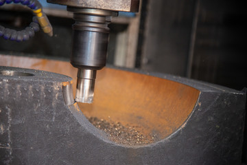 The CNC milling machine rough cutting the cast iron mold parts with indexable radius endmill tool....