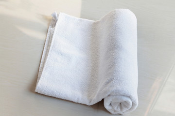 Fototapeta na wymiar White towel on the bed.