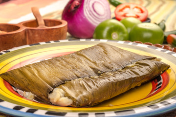 Oaxacan tamal made of corn chicken pork and chili