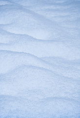 Snow texture. Natural winter background with snow waves