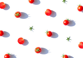 Organic cherry tomatoes on the white background. Top view food seamless pattern. Copy space