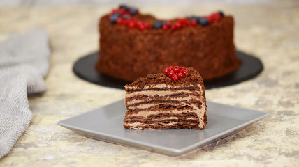 Piece of French Chocolate Napoleon cake of puff pastry with custard.